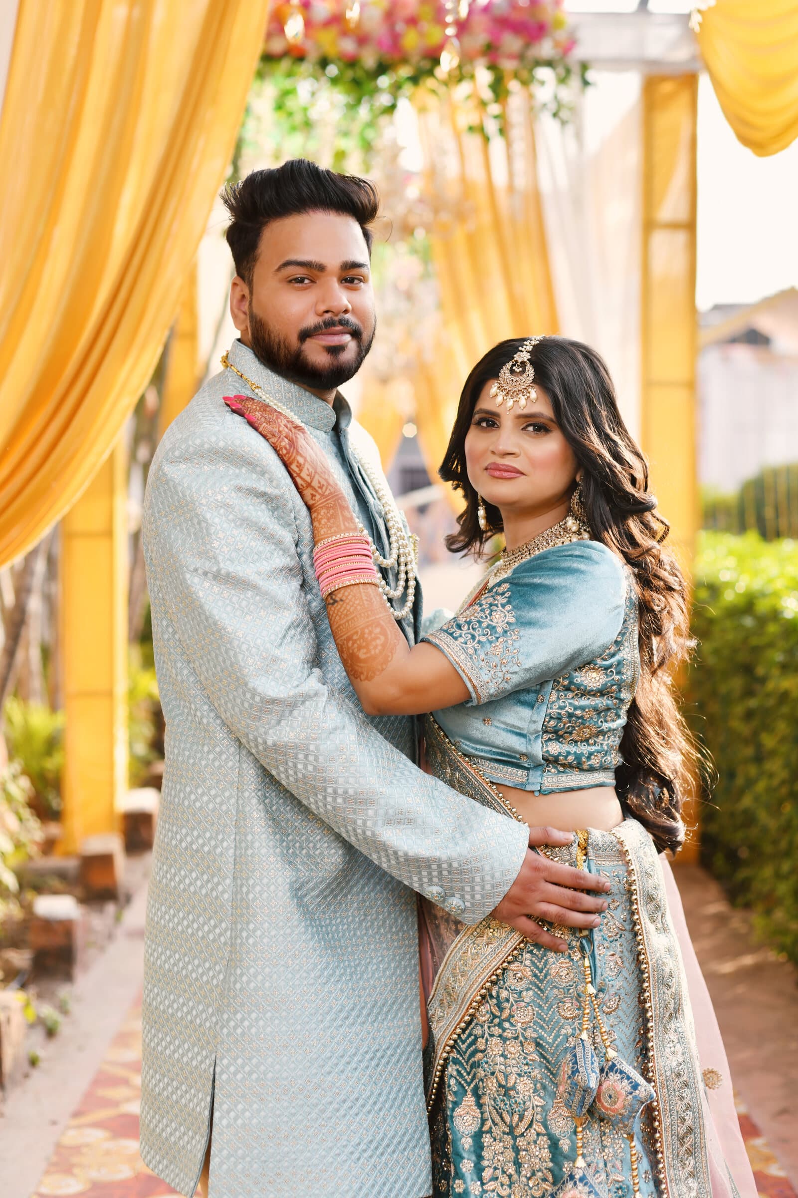Couple embracing at golden hour during their wedding
